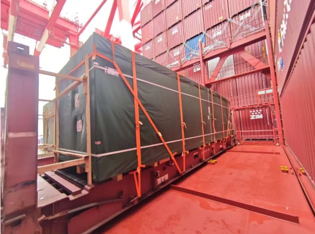 A lashed flat rack secured on board the vessel